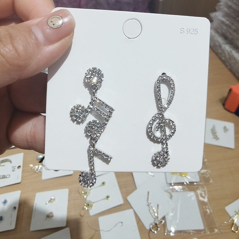 Silver needle inlaid with diamonds asymmetrical jumping notes earrings minimalist earrings