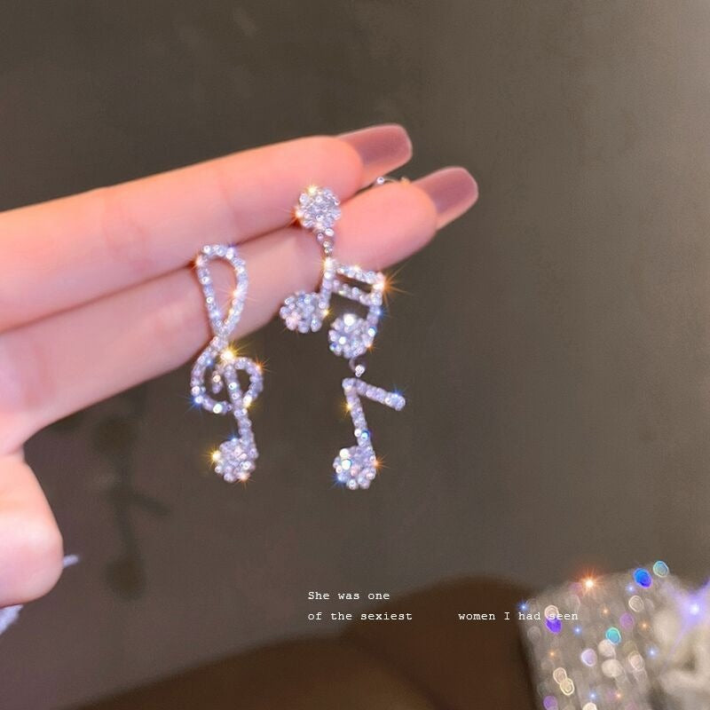 Silver needle inlaid with diamonds asymmetrical jumping notes earrings minimalist earrings